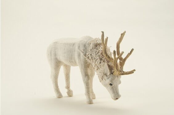 Decorative stag grazing, white with collar