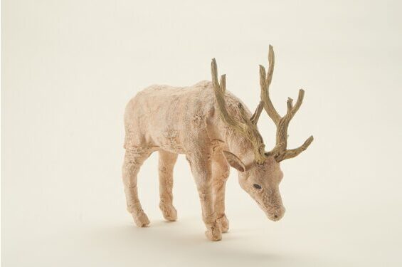Decorative stag grazing, pink